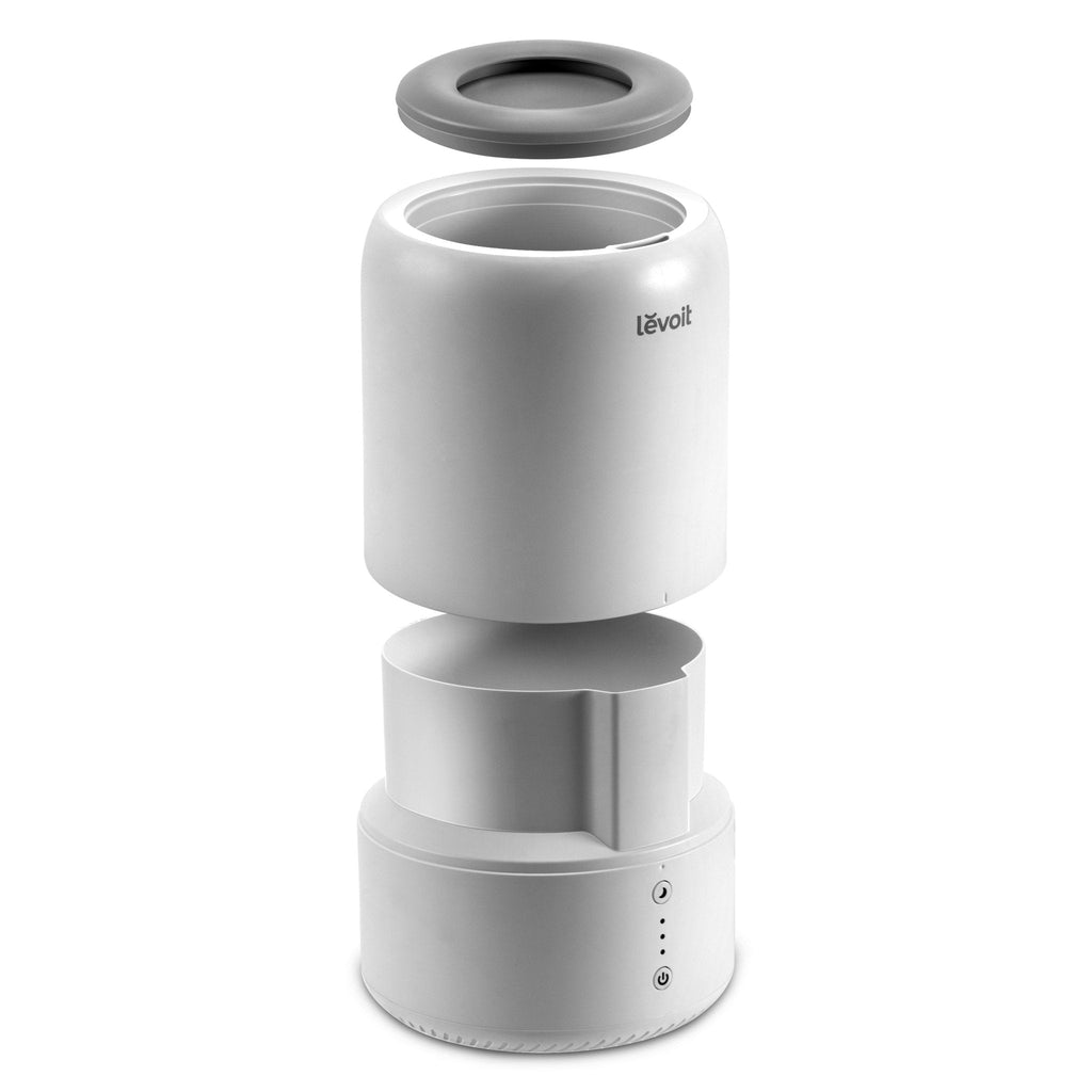 Levoit Dual 100 Ultrasonic Top-Fill Cool Mist 2-in-1 Humidifier & Diffuser disassembled, showing components for easy setup and maintenance.