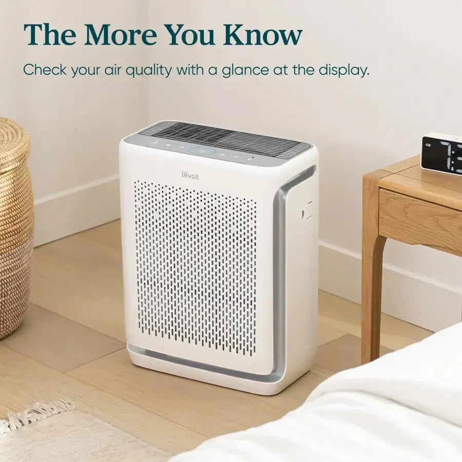 Levoit Vital 200S-P Smart Air Purifier in a bedroom displaying real-time air quality updates at a glance.