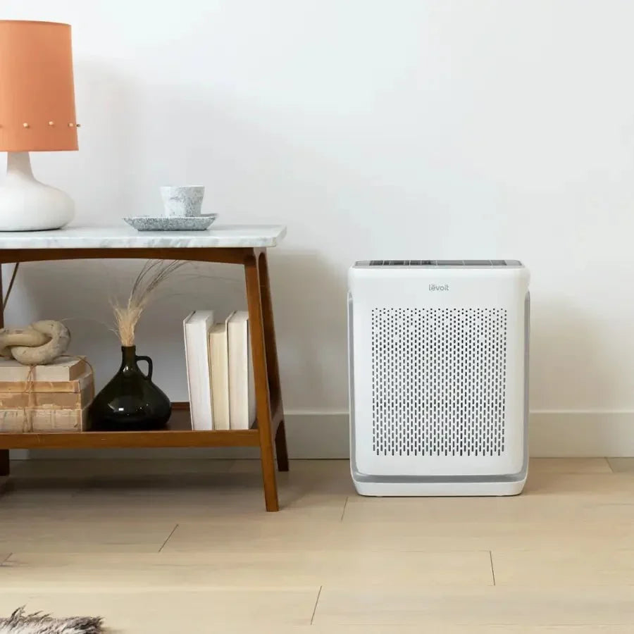 Levoit Vital 200S-P Smart Air Purifier White/Grey placed on the floor in a modern living room setting.